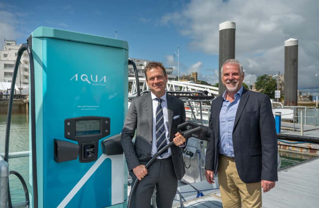 Isle of Wight MP Bob Seely with Cowes Harbour CEO Gary Hall  pictured in front of newly installed Aqua superPower fast charge station 