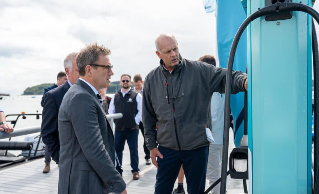 Aqua superPower CEO Alex Bamberg explains how the charging stations work to MP Bob Seely