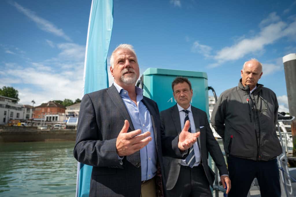 Cowes Harbour CEO Gary Hall makes short speech in front of the fast chargong station alongside are MP Bob Seely and Aqua superPower CEO Alex Bamberg