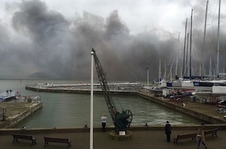 Smoke from the Medina Village fire blows down the river and across the harbour