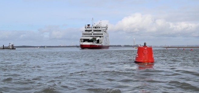 Red Funnel vehicle ferry entering Cowes Harbour - No 4 buoy in the foreground
