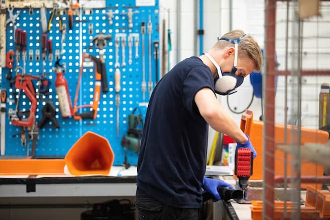 Working on a component for one of the inshore lifeboats - Credit: RNLI - Nathan Williams